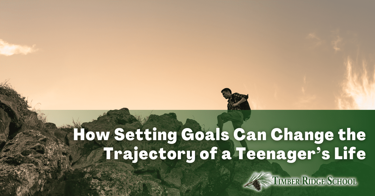How Setting Goals Can Help Teenagers. Boy climbing a mountain.